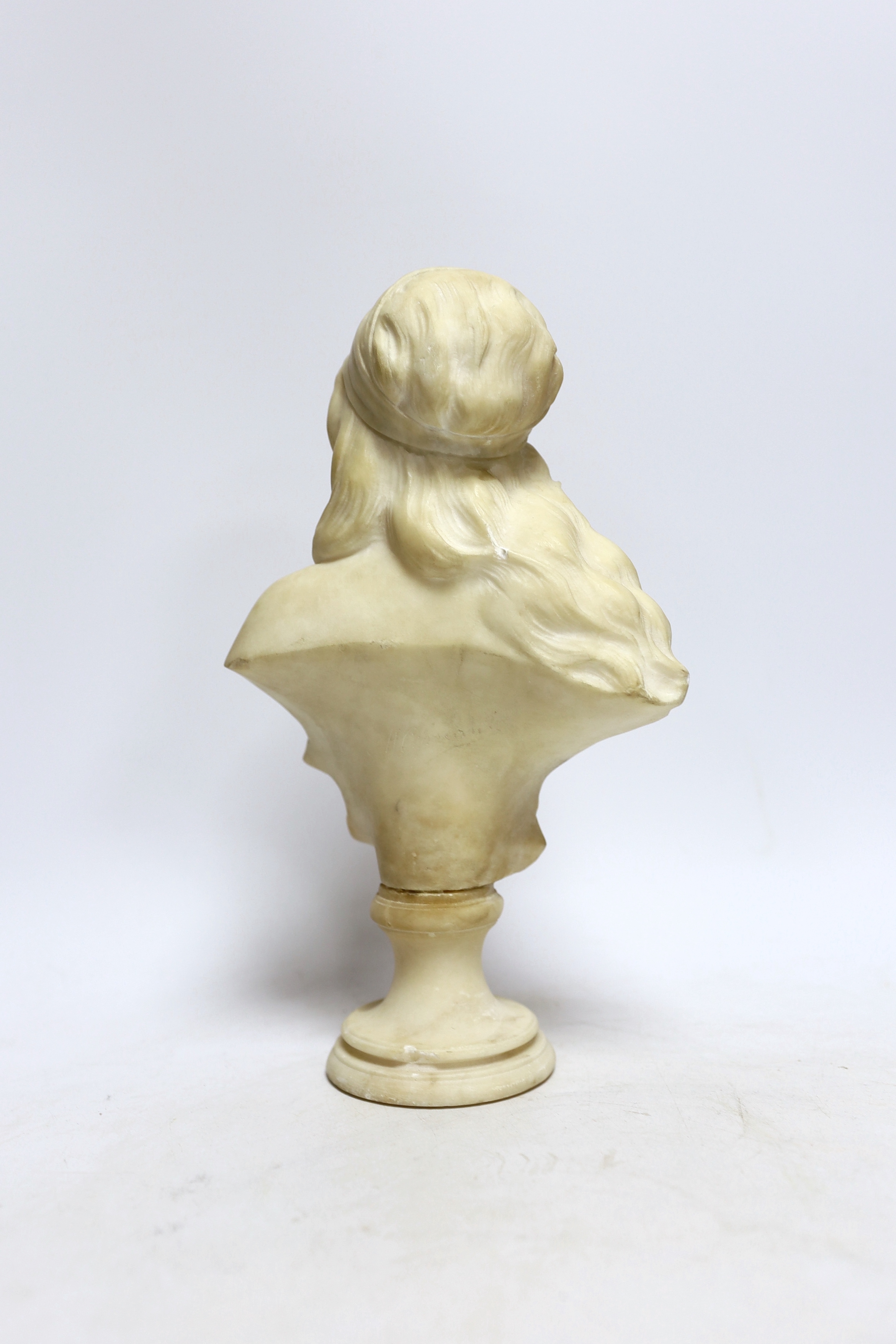 A small alabaster female bust signed H. Cipriani, 26.5cm high